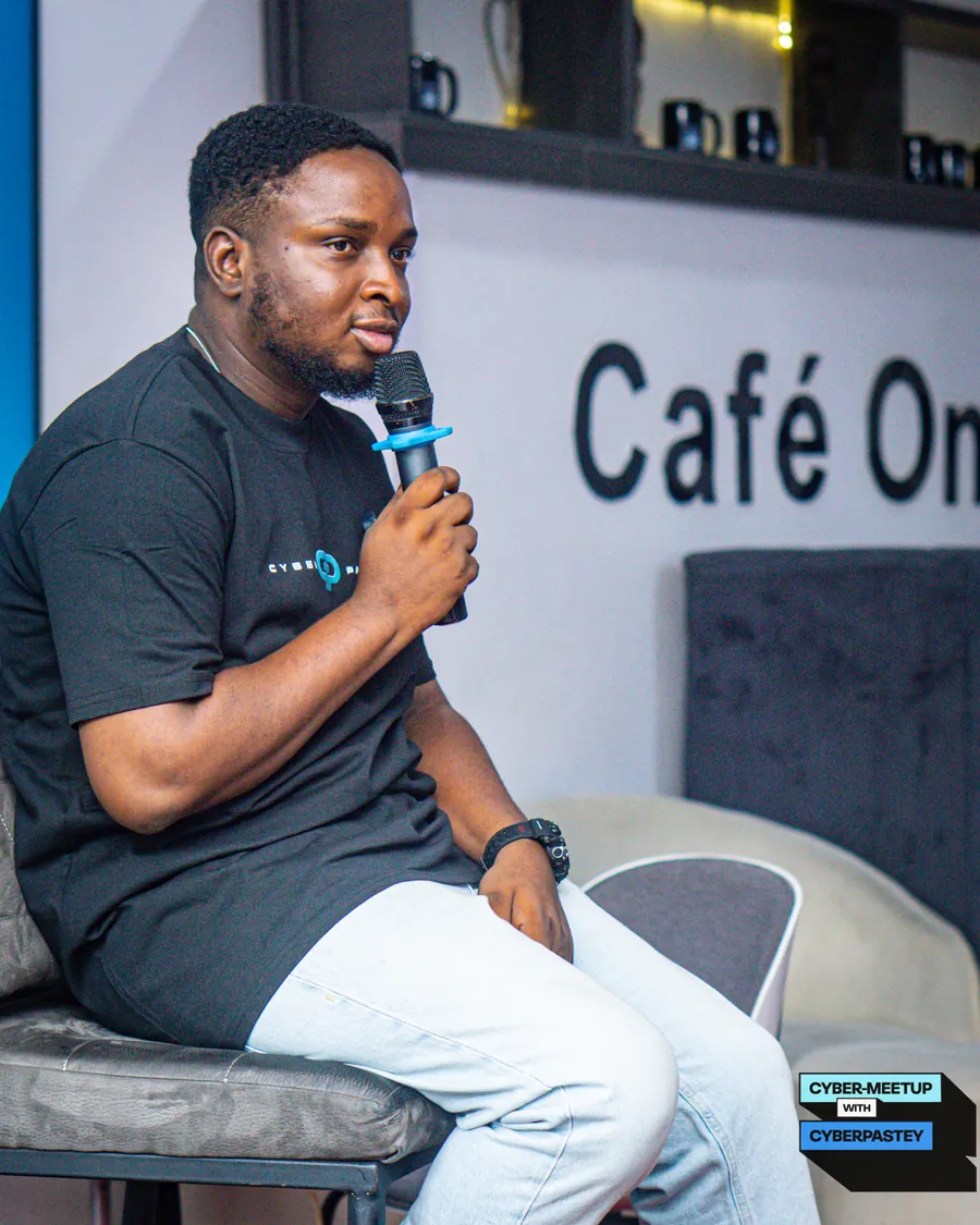 CyberPastey convener seated with a microphone during the roundtable