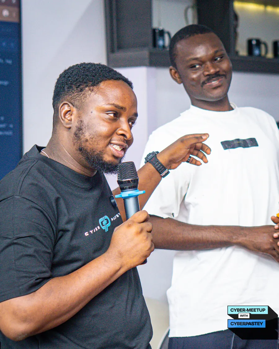 A speaker smiling while contributing to the Cyber Meetup conversation