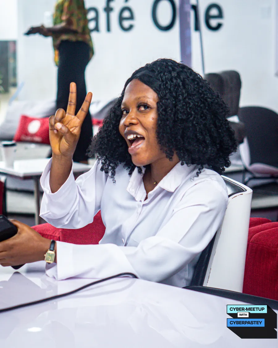 An attendee contributing enthusiastically during a Cyber Meetup discussion